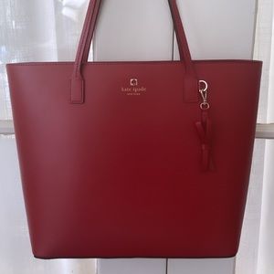 Red Kate Spade leather purse, hardly used. Perfect for work.